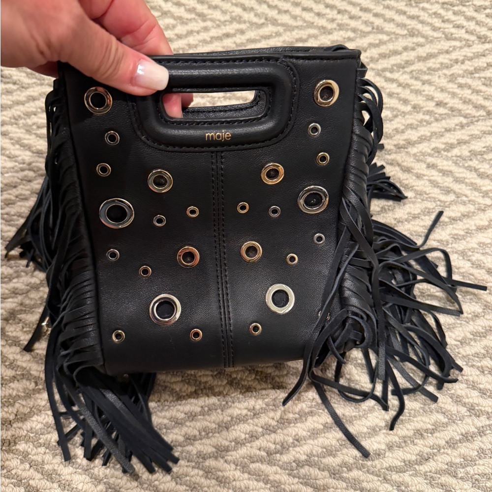 Maje Black Mini Fringe Bag with mixed gold and silver eyelets.